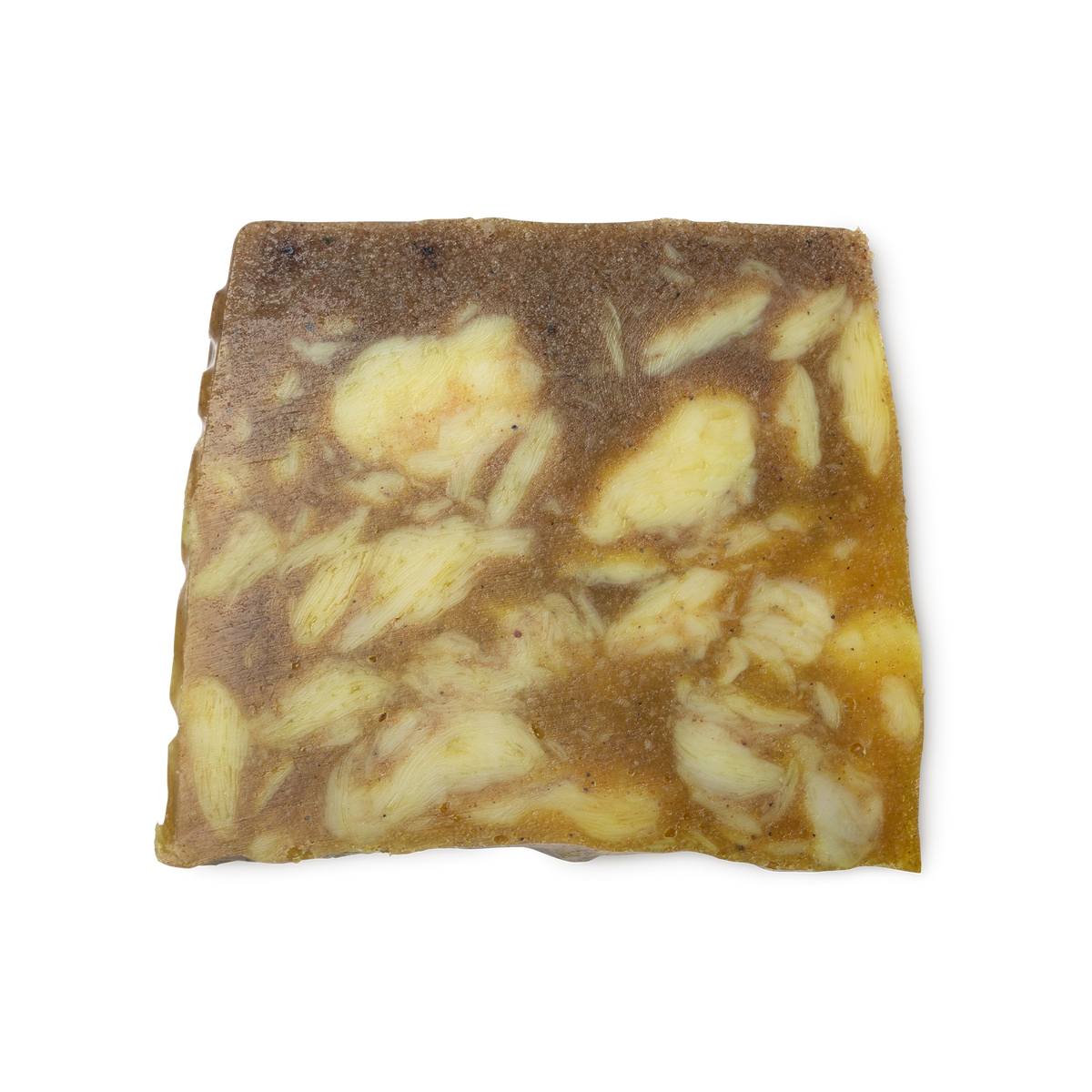 Sandstone. A sandy yellow coloured, trapezium shaped soap, with a roughly textured surface and bumps along its left side.